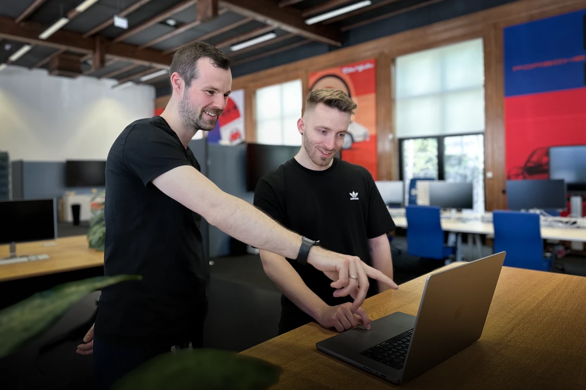 The Open Source Maintainers, co-working on a laptop