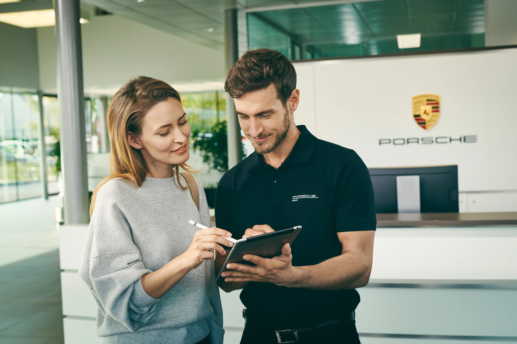 Software developers checking content on a tablet