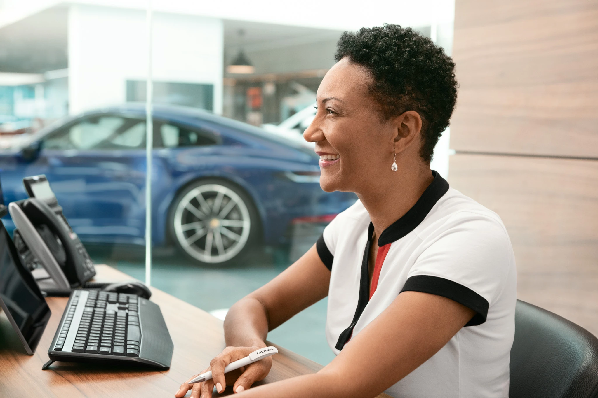 Female developer smiling at her desk
